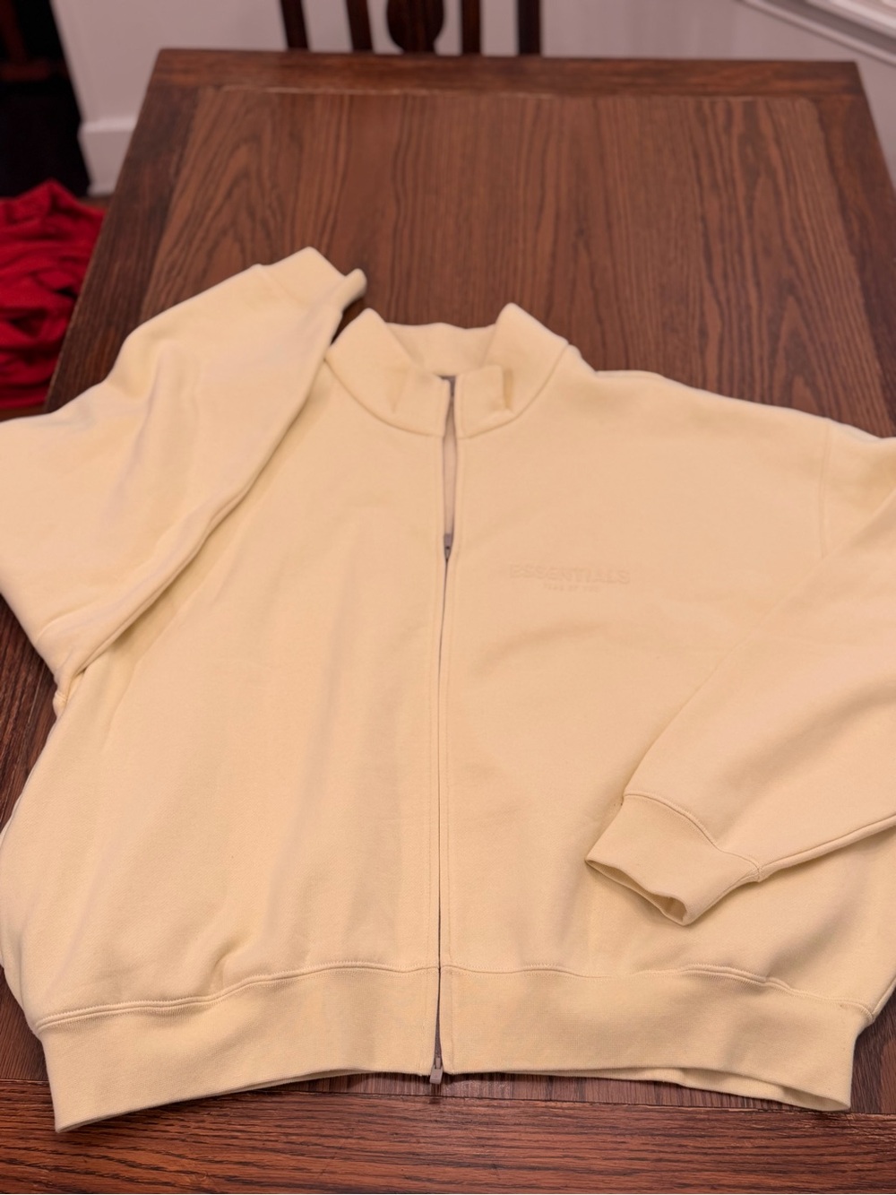 Fear of God Essentials full-zip fleece jacket in a pale yellow
